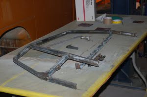 Driver's door window frame being restored.